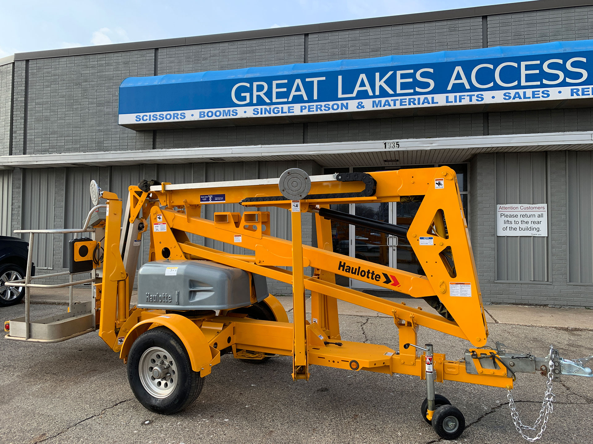 Great Lakes Access storefront behind trailer boom lift