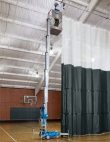 Single person lift being used in gymnasium